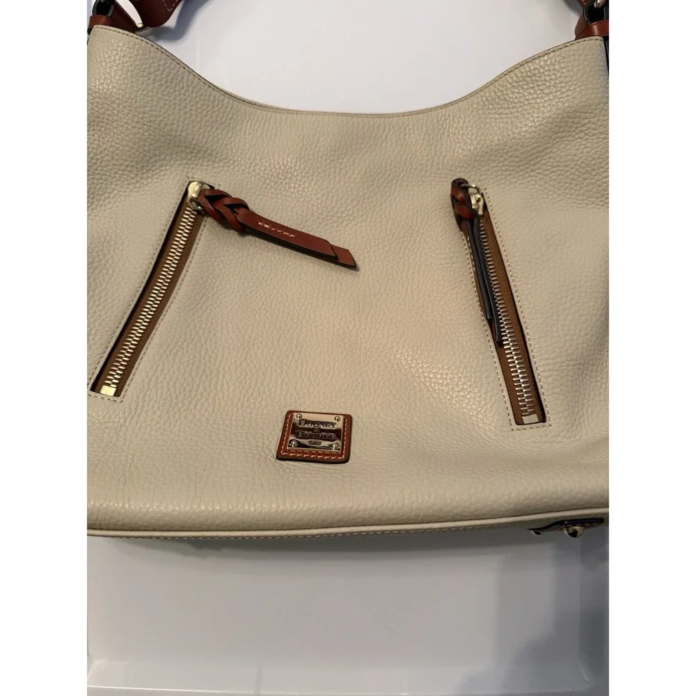 Dooney & Bourke Hobo Bag Women Large Cream Pebbled Leather Tan Trim Logo Plaque
